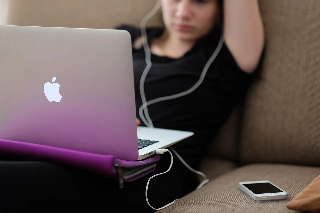 A woman using a laptop at home