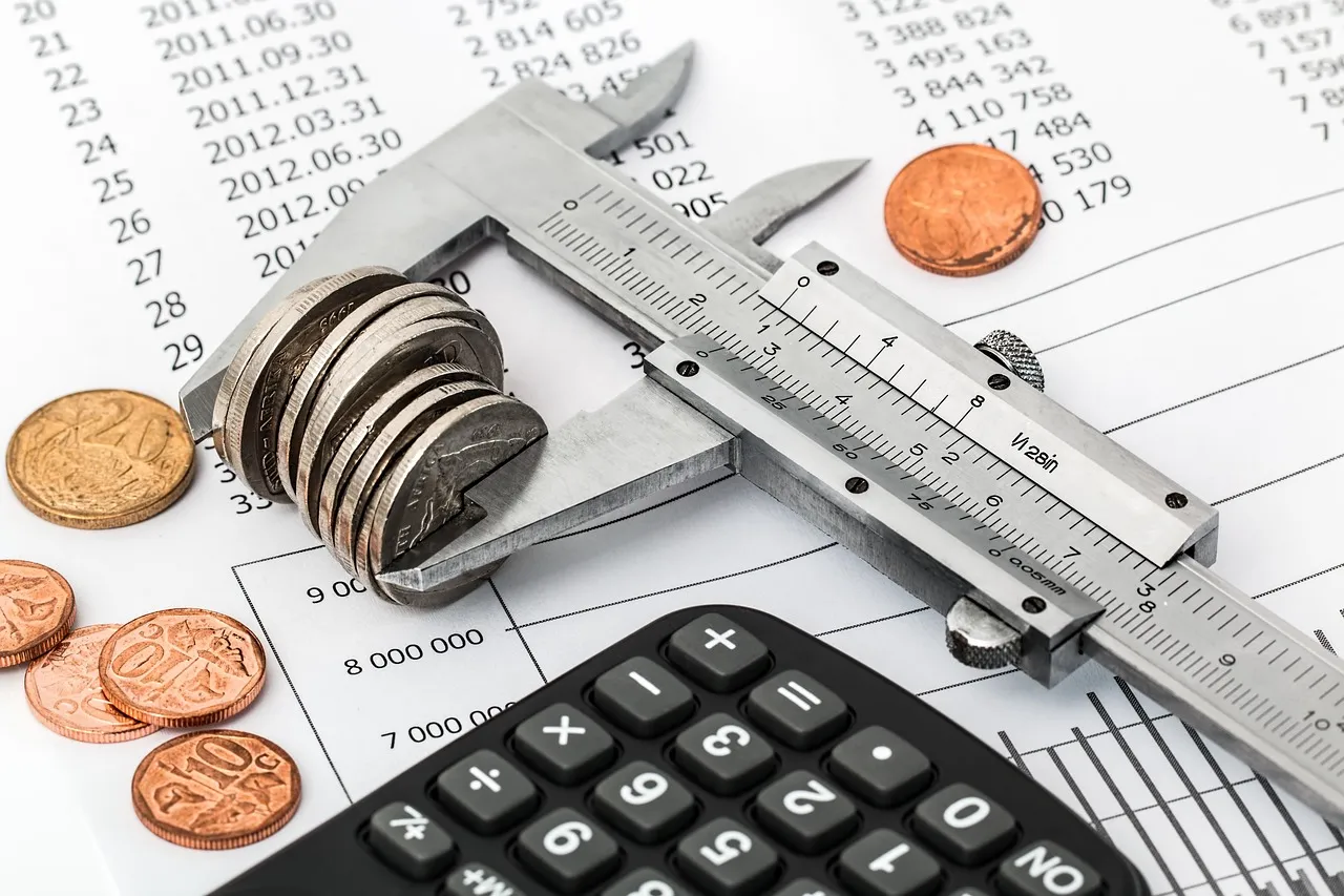 Tax documents and a calculator on a desk