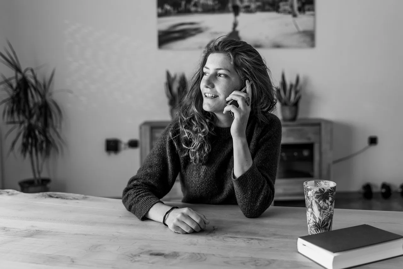 A person talking on the phone to a helpline