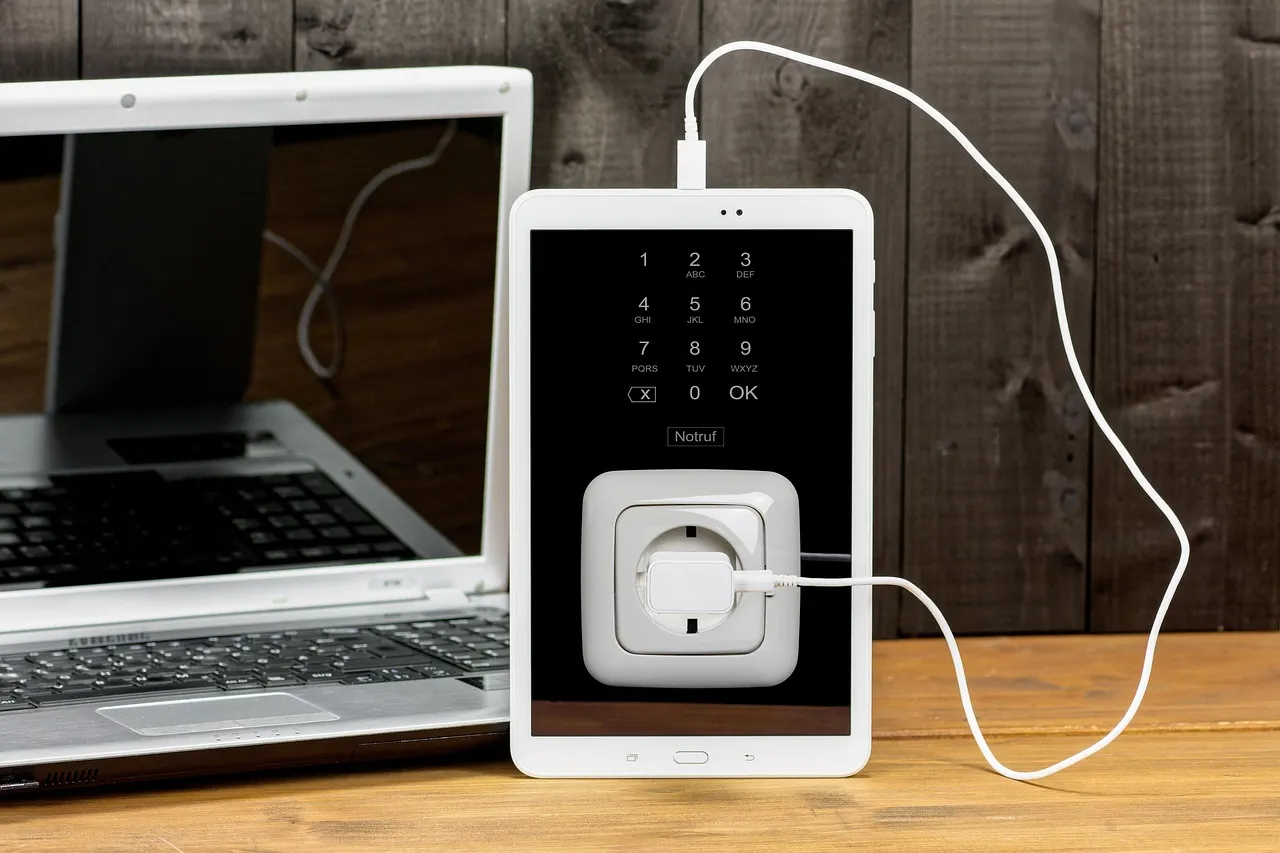 A laptop charger plugged into a wall socket