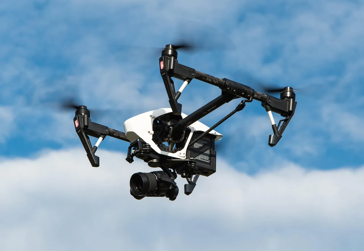 A drone in the air against the sky