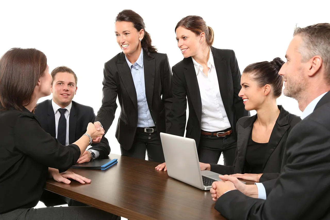 A small company team meeting around a table in an office