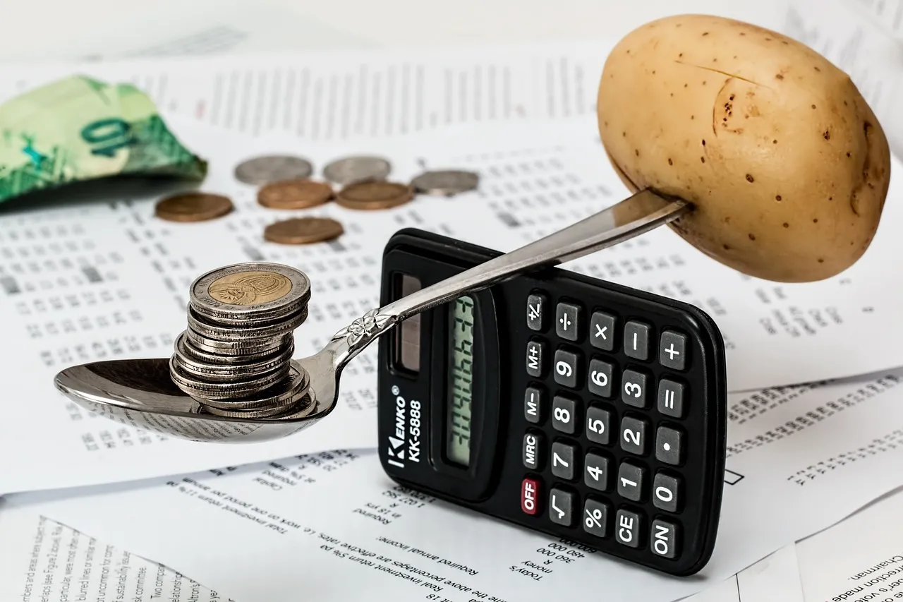 A calculator and financial documents on a desk