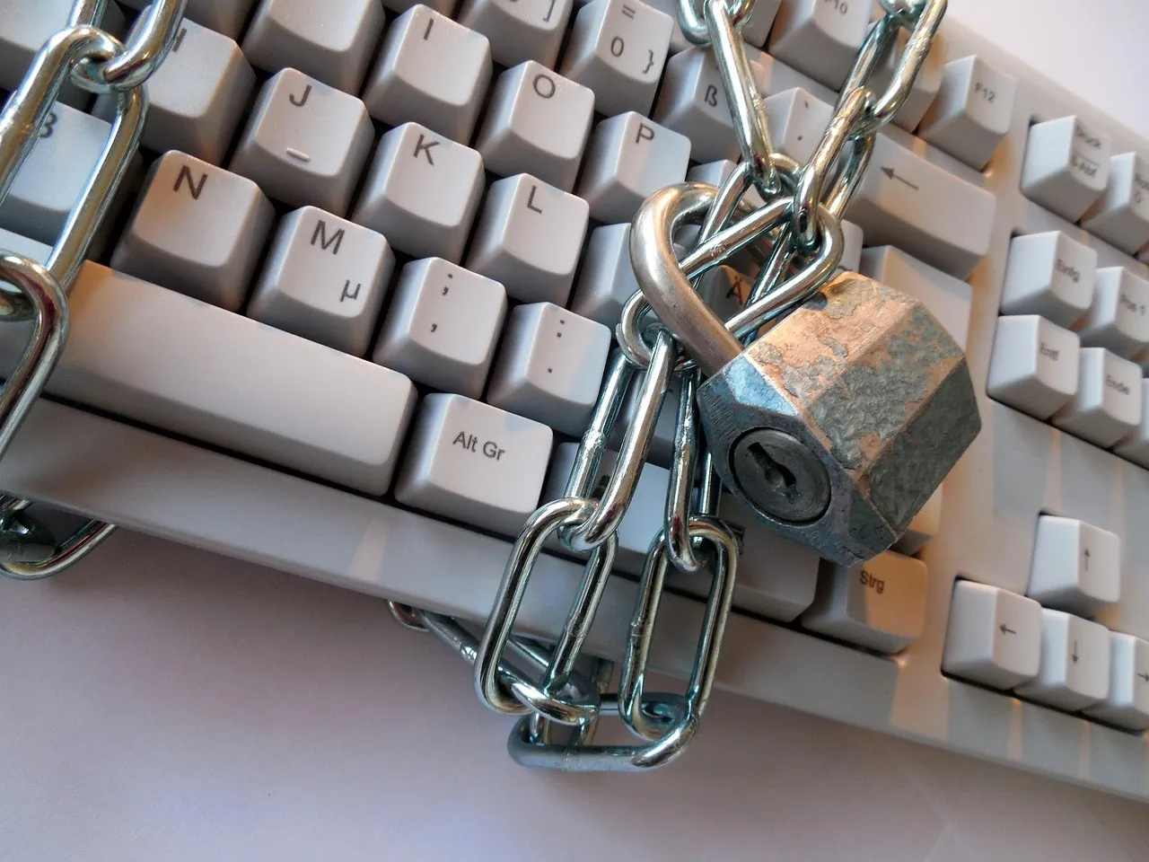 A padlock on a computer keyboard as a symbol of cyber security