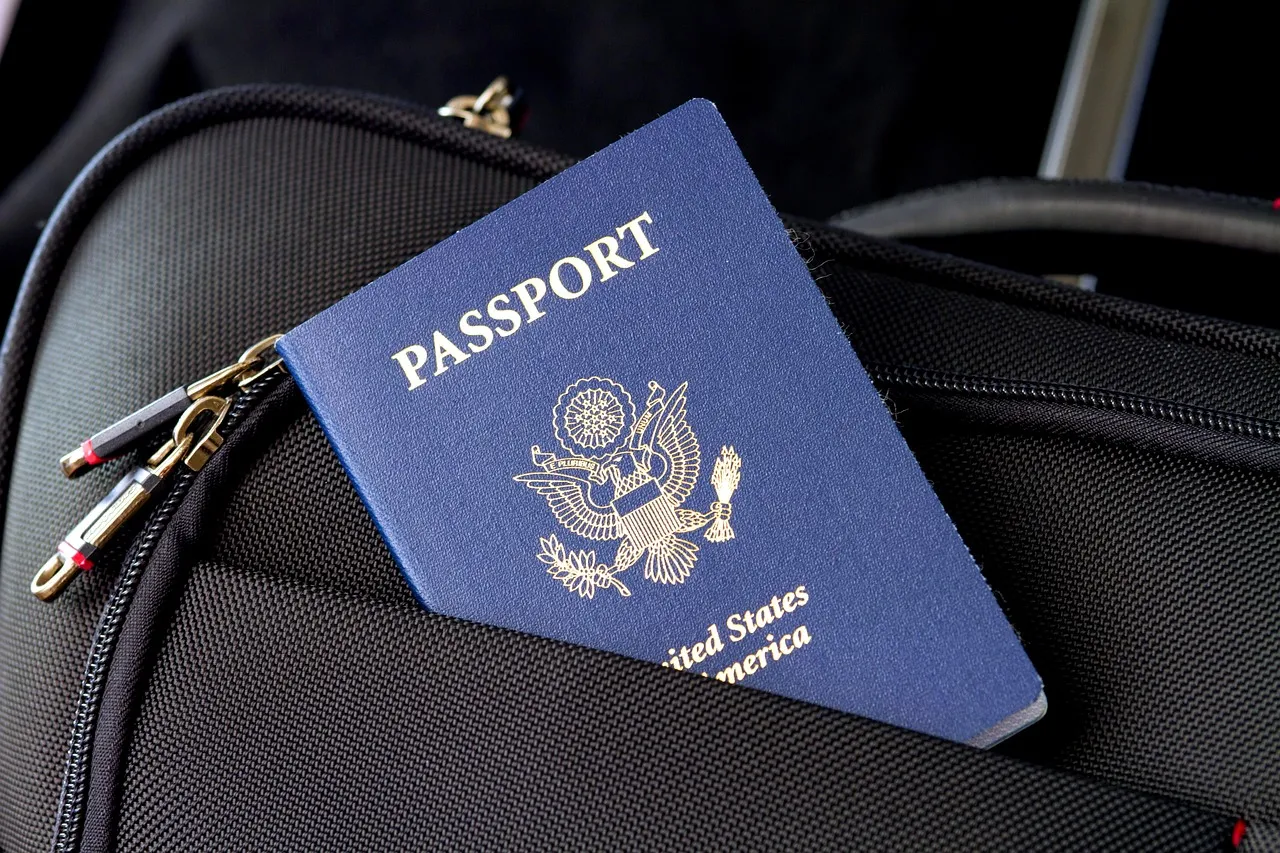 Suitcase and travel documents on a table